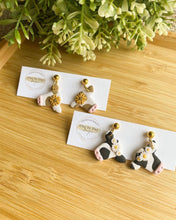 Load image into Gallery viewer, Clay by Day Designs - Floral Crown Cow. Country western - polymer clay earring : Brown with Sunflower-Clay by Day Designs-Evolution Equestrian Co.