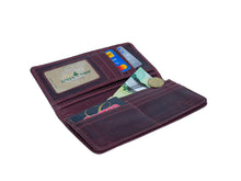 Load image into Gallery viewer, Open leather wallet with cards and money on a light blue background