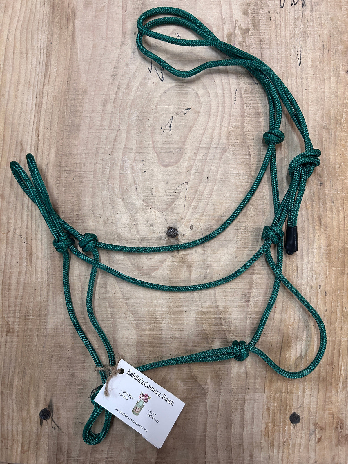 Soft Rope Halter for Horses in a dark green with rubber wrapped end. 