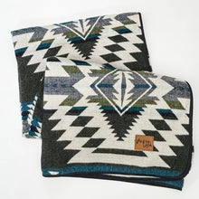Load image into Gallery viewer, Patterned blanket with geometric design on a white background
