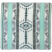 Load image into Gallery viewer, Patterned blanket with geometric design on a white background
